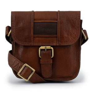 The Dawn Women's Leather Cross Body Bag in Cognac with brown leather label and buckle detail